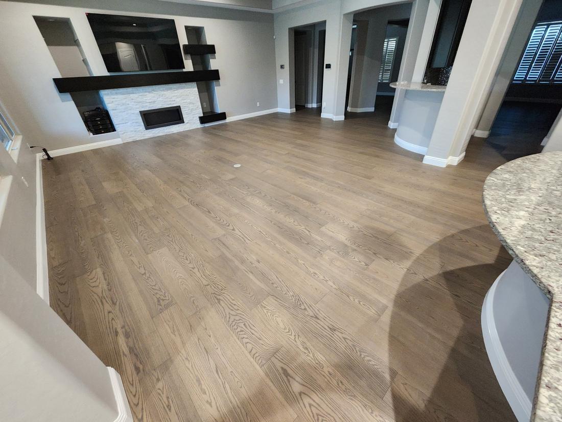 Engineered hardwood in a family room with a fireplace